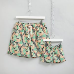 Matching dad and son pastel palm swim shorts